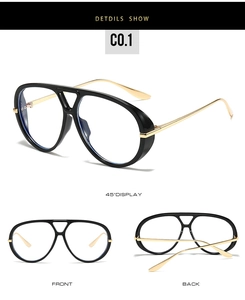 Detail of oversized aviator frame with black rims and gold metal temples and blue light lenses