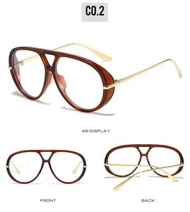 Detail view of large aviator eyewear frame with amber rims and gold metal temples