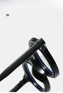 Detail of high-gloss black eyewear hinges showing durable and flexible frame structure