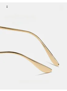 Detail of curved gold metal temples for oversized aviator sunglasses with comfortable arc