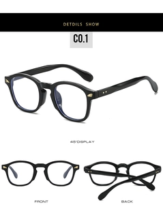 Close-up of black round frames featuring gold wing decorative rivets and side model C0.1