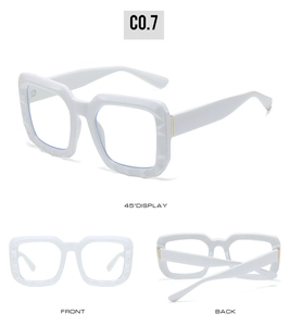 Detail view of white oversized square glasses frames with faceted texture from three angles
