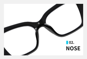 Close-up of the bridge and nose pads on black cat-eye resin eyeglass frames