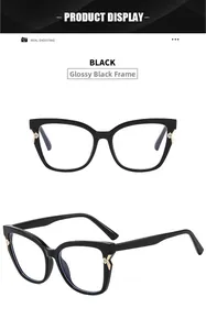 Close-up of cat-eye glasses frame featuring gold cross stars and rhinestone temple details