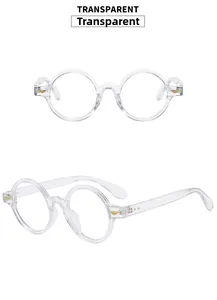 Detail of transparent round frame glasses showing the golden metal wing hinge accents