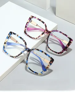 Cat-eye blue light blocking glasses with gold metal temples and stone texture frames