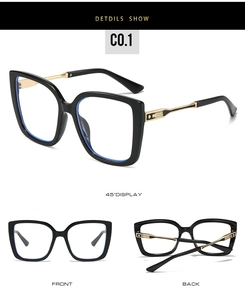 Detail view of black cat-eye anti-blue light glasses with golden metal accents at the hinges