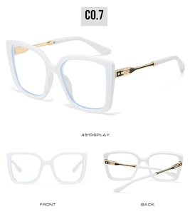 Detail view of white cat-eye glasses with gold metal temples and star decorations
