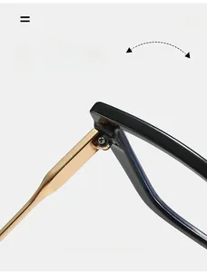 Detail of durable gold metal hinge on black cat-eye glasses with sturdy screw reinforcement