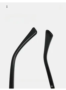 Detail of glossy black curved temples for cat-eye glasses providing comfortable fit