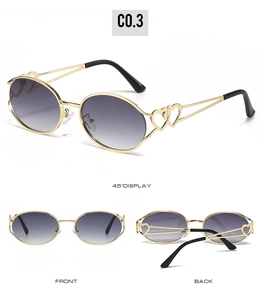Détail de lunettes Y2K avec monture en métal doré en forme de cœur et verres dégradés