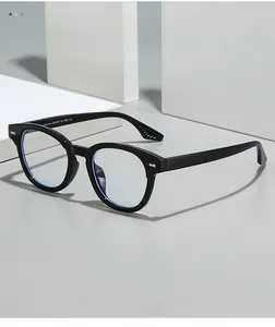 Detail of black round frame glasses with Italian design engraving on the temple arm