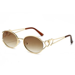 Lunettes de soleil ovales Y2K pour femmes avec monture dorée et détail de cœur