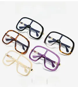 Detail of oversized retro fashion glasses with wide temples and metal hinges in varied colors