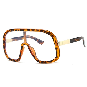 Oversized tortoise shell glasses frames with transparent lenses and gold metal accents