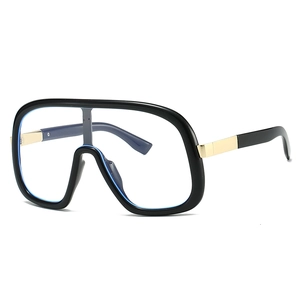 Modern oversized shield glasses in glossy black with gold accents and blue lens edge