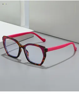 Detailed view of tortoiseshell frame glasses with contrasting vibrant pink temples