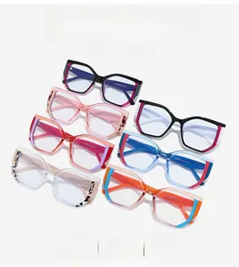 Flat lay of colorful cat-eye TR90 eyeglass frames with leopard print temple details