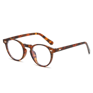 Retro amber round frame glasses with vintage studs shown at a 45-degree angle