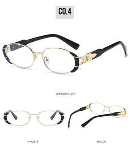 Detail view of vintage oval metal sunglasses with gold frames and black accents