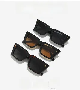 Macro detail of square retro sunglasses with metal hinges in black and tortoiseshell