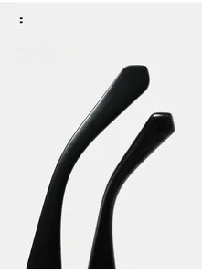 Macro view of curved mirror legs on black sunglasses for enhanced wearing comfort