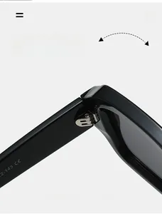 Close-up of durable metal hinge on black square frame sunglasses for men