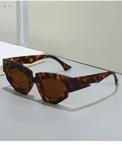 Macro shot of stylish tortoiseshell geometric sunglasses with dark brown lenses and thick frames
