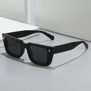 Retro square cat-eye sunglasses in black frame with gold accents and dark lenses