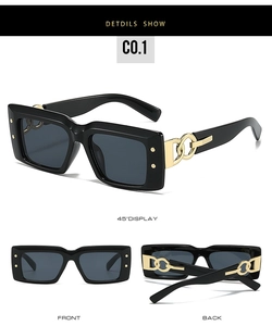 Detail of vintage rectangular sunglasses with bold gold chain metal on black frames