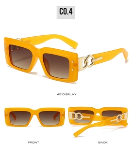 Detail view of yellow rectangle sunglasses with golden chain accents and gradient lenses