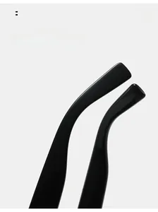 Detail view of smooth curved mirror legs on modern black sunglasses with glossy finish