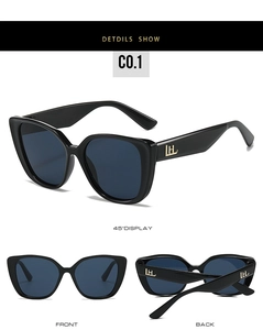 Détails des lunettes de soleil œil de chat avec monture noire et logo LH doré sur la branche