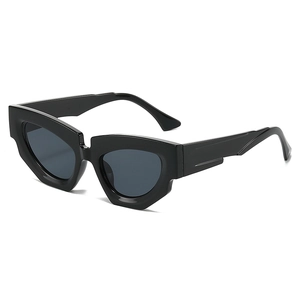 Fashionable black cat eye sunglasses with thick geometric irregular frames for street style