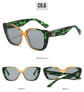 Vues détaillées de lunettes papillon avec motif écaille verte et logo LH métallique