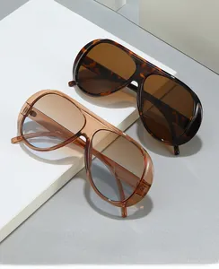 Close-up of retro aviator sunglasses in dark tortoiseshell and translucent amber finishes