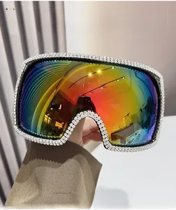 Detailed shot of large square sunglasses with rainbow gradient lenses and diamond rhinestones