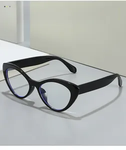 Detail of glossy black cat-eye glasses with anti-blue light coating on clear lenses