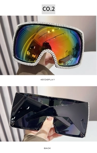 Detail view of square oversized sunglasses with rhinestones and rainbow mirror lenses
