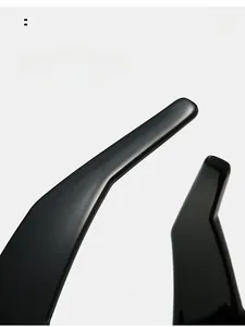 Macro detail of ergonomic curved mirror legs on oversized square resin sunglasses