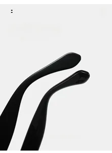 Close-up of curved black glossy temple legs on cat-eye glasses for comfortable fit