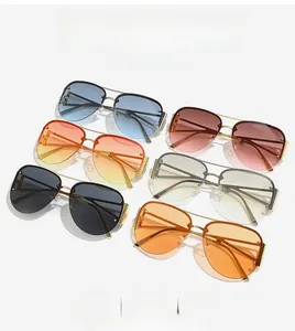 Detail of metal half-frame sunglasses with various gradient lenses and rivet accents