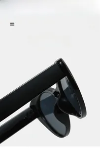 Detail of glossy black cat-eye frames featuring lightweight super elastic hinges