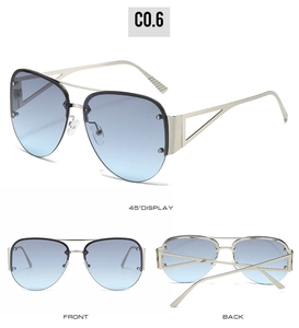 Detail view of silver aviator sunglasses featuring light blue gradient lenses and hollow frame