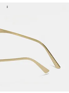 Detail of gold metal glasses frames showing curved temples with non-slip wavy texture