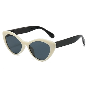 Stylish cream and black cat-eye sunglasses for women with dark grey lenses in 45-degree view