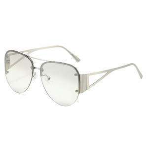 Silver metal half-frame aviator glasses with geometric cutout temples and clear lenses