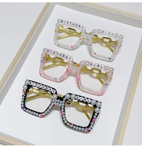 Detailed view of Birthday Girl square glasses with pearls and decorative rhinestones