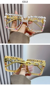 Detail of square glasses frames with Birthday Girl pearls and gold chain temples