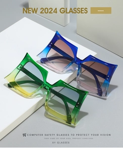 Detail of square oversized geometric sunglasses with gradient frames and sharp edges